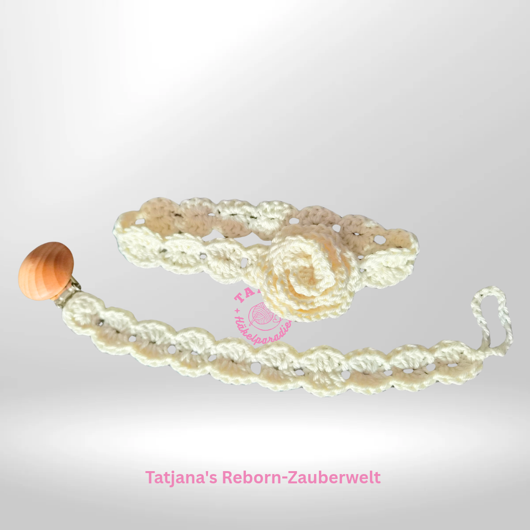 Ein Set aus Schnullerband und ein passendes Haarband